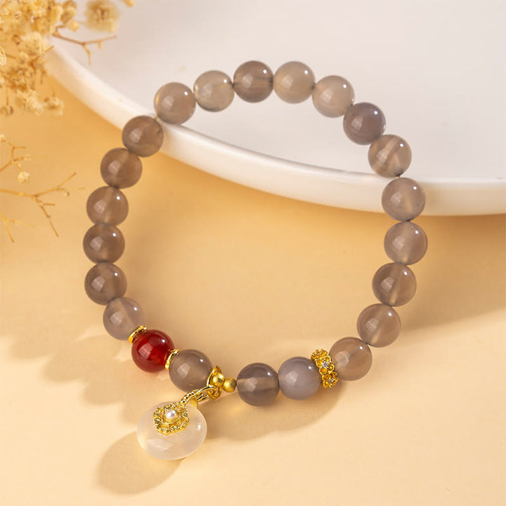 Pulsera de equilibrio con Buddha Stones, ágata gris, ágata roja y calcedonia. - image 1