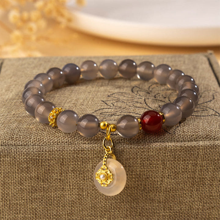 Pulsera de equilibrio con Buddha Stones, ágata gris, ágata roja y calcedonia. - Ágata gris (circunferencia de la muñeca: 15-16 cm) - image 0
