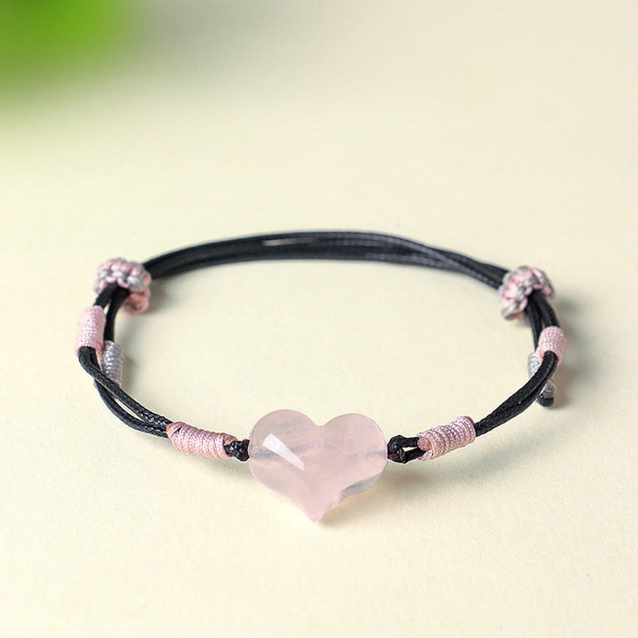 Pulsera cálida de hilo trenzado con cristales rosas y dijes de corazón natural de Buddha Stones - image 1