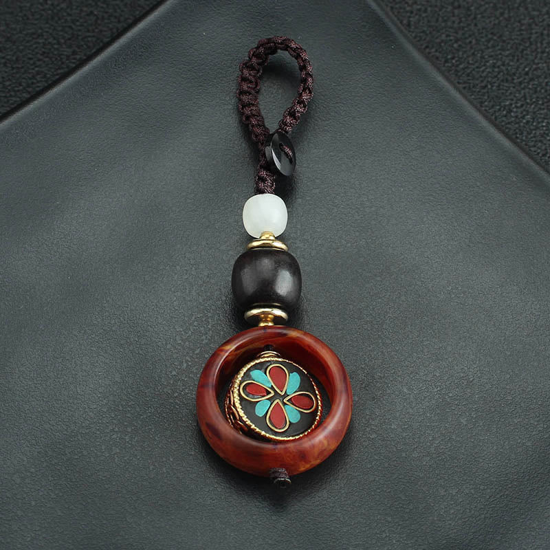 Llavero giratorio con Buddha Stones, madera de ébano, trébol de cuatro hojas en sánscrito, ojo de Buda y paz. - image 9