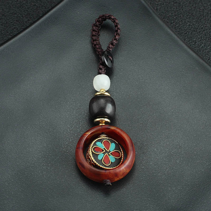 Llavero giratorio con Buddha Stones, madera de ébano, trébol de cuatro hojas en sánscrito, ojo de Buda y paz. - image 9