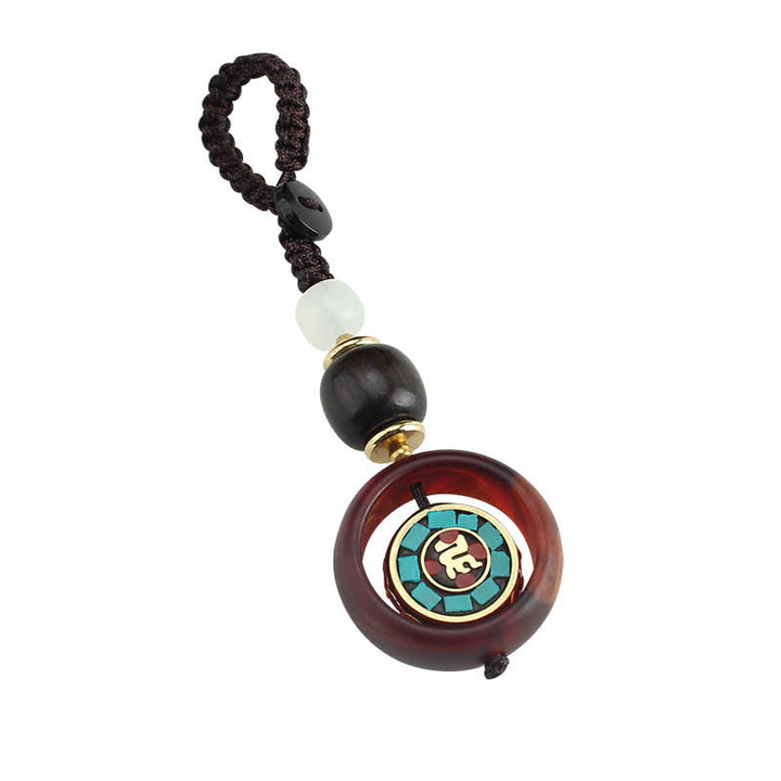 Llavero giratorio con Buddha Stones, madera de ébano, trébol de cuatro hojas en sánscrito, ojo de Buda y paz. - image 4