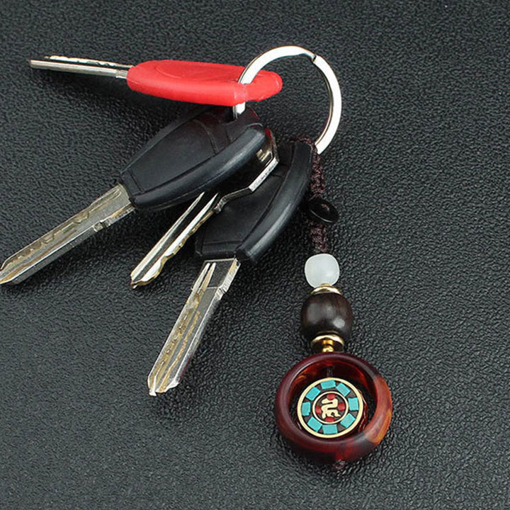 Llavero giratorio con Buddha Stones, madera de ébano, trébol de cuatro hojas en sánscrito, ojo de Buda y paz. - image 3