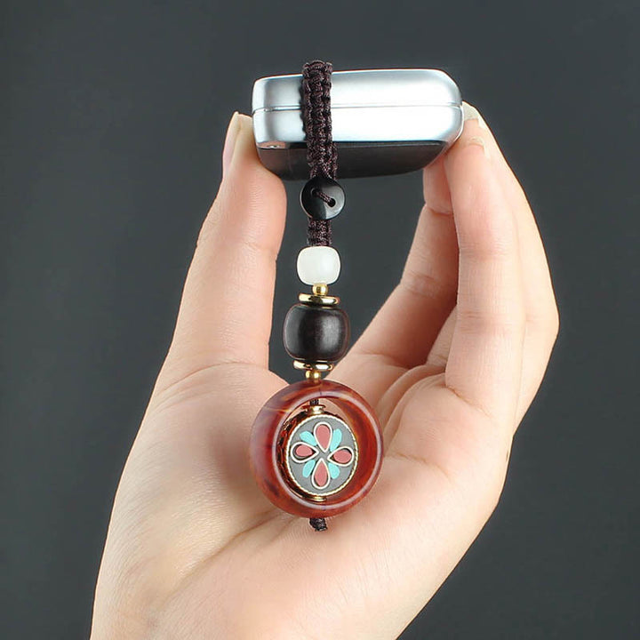 Llavero giratorio con Buddha Stones, madera de ébano, trébol de cuatro hojas en sánscrito, ojo de Buda y paz. - image 11