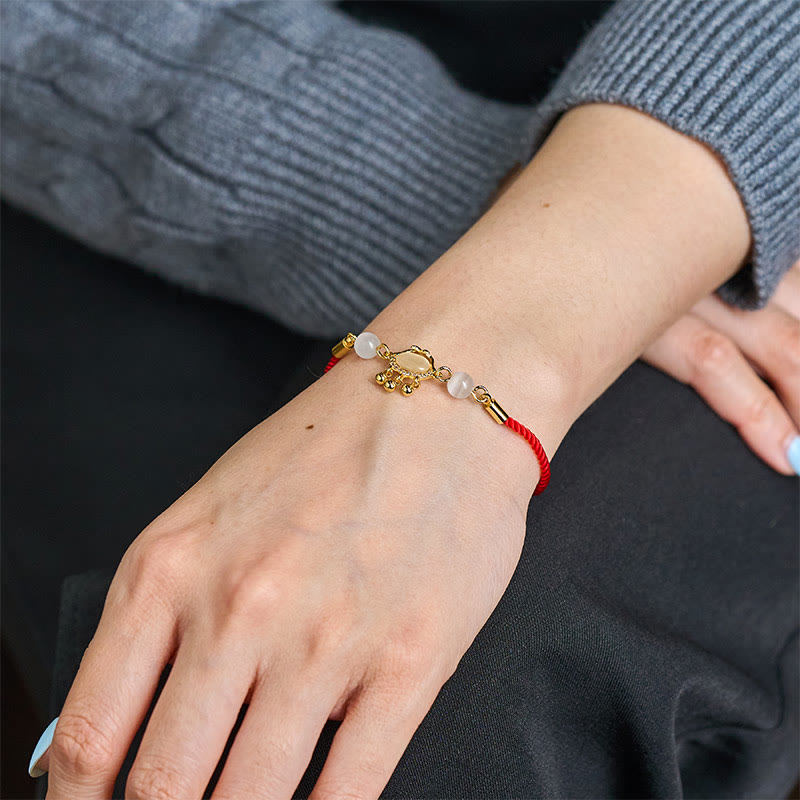 Pulsera protectora chapada en oro y cobre con abalorio de ojo de gato y Buddha Stones - image 5