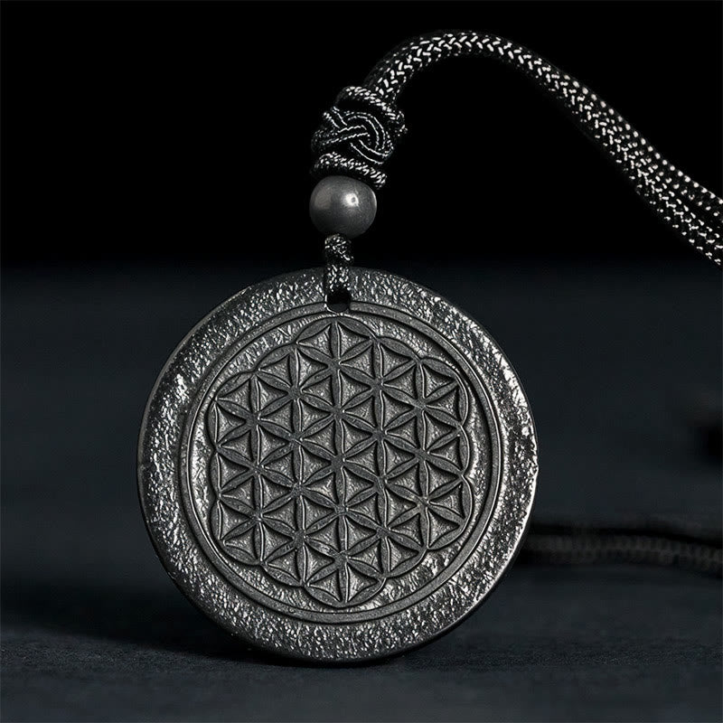 Collar con colgante de protección de piedra de shungita auténtica con diseño tallado de Buddha Stones - Flor de la Vida (Relieve tallado) - 35-40 mm - image 0