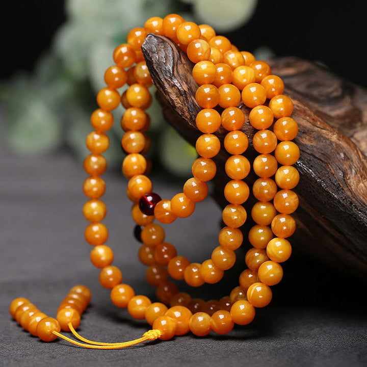 Mala de cuentas redondas de ámbar tibetano con Buddha Stones - 10 mm - image 0