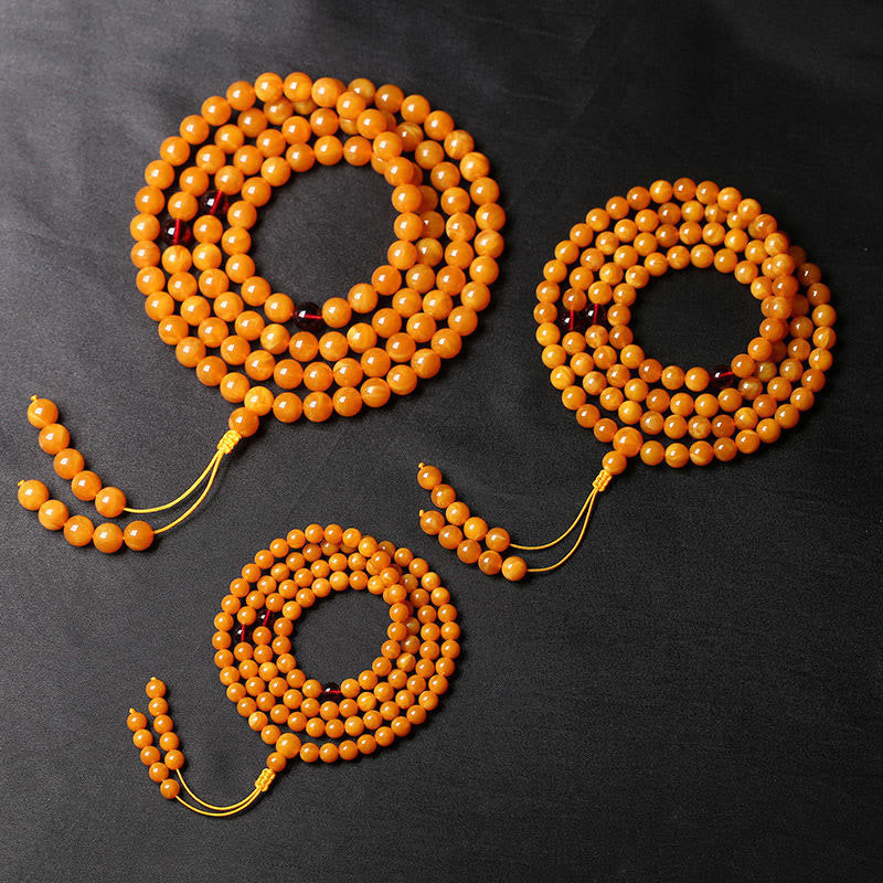 Mala de cuentas redondas de ámbar tibetano con Buddha Stones - image 1