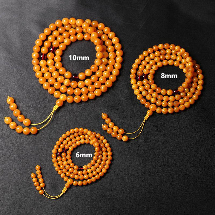 Mala de cuentas redondas de ámbar tibetano con Buddha Stones - image 5