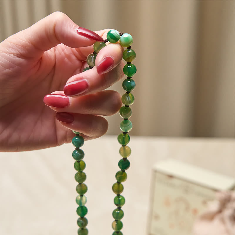 Pulsera protectora con borlas de malaquita y cuentas de Buddha Stones - image 4