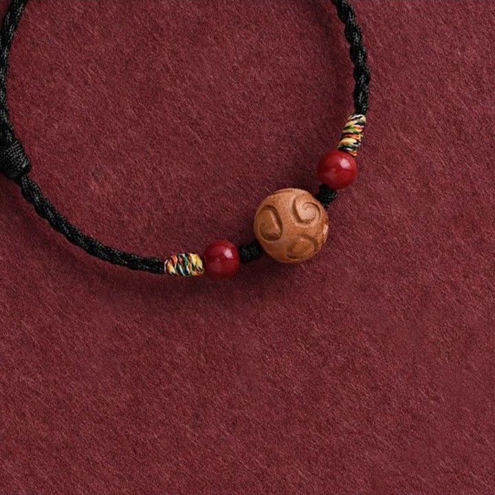Pulsera de cuerda de madera de melocotón natural con Buddha Stones talladas y patrón auspicioso - image 14