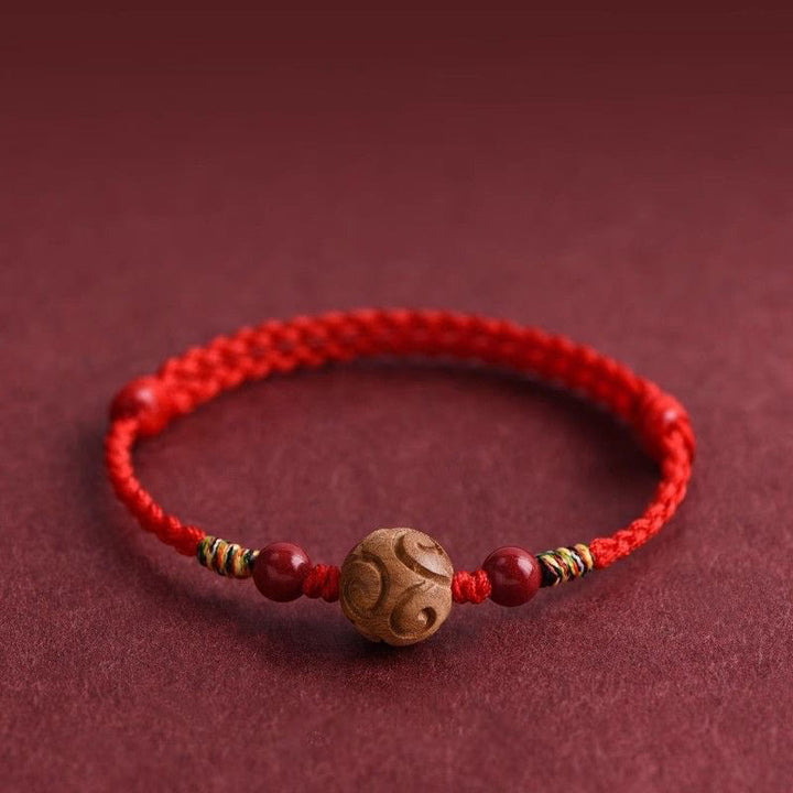 Pulsera de cuerda de madera de melocotón natural con Buddha Stones talladas y patrón auspicioso - image 0