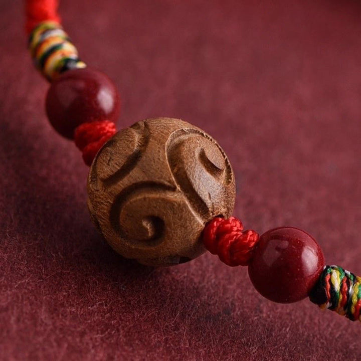 Pulsera de cuerda de madera de melocotón natural con Buddha Stones talladas y patrón auspicioso - image 3