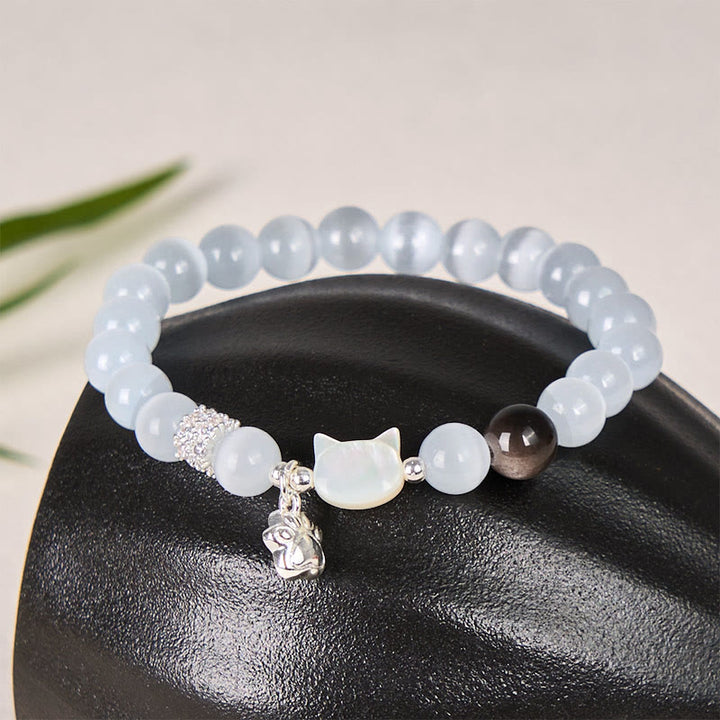 Buddha Stones Pulsera positiva de obsidiana plateada con brillo de ojo de gato blanco y cabeza de gato - Cuentas de ojo de gato blancas de 8 mm (circunferencia de la muñeca: 14-15 cm) - image 0