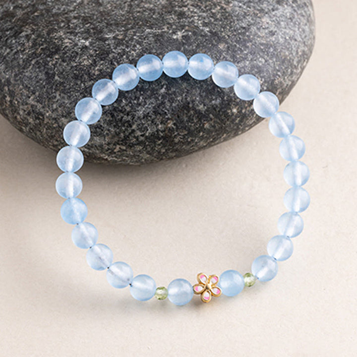 Buddha Stones Pulsera de cobre chapada en oro con aguamarina natural y flores para sanación - image 1