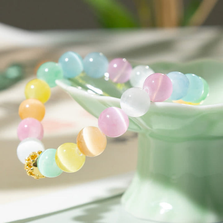 Buddha Stones Pulsera con cuentas redondas multicolores de diseño hueco y forma de ojo de gato. - image 1