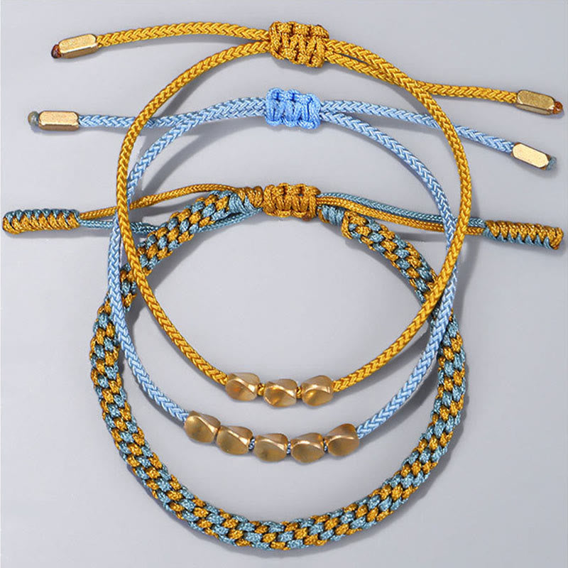 Buddha Stones Pulsera curativa de 3 piezas con cuentas de cobre dorado y hilo azul y amarillo. - image 1