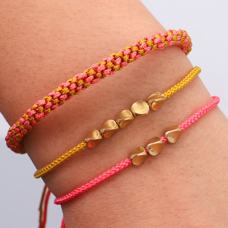 Buddha Stones Pulsera de la riqueza de 3 piezas con cuentas de cobre dorado y rosa y hilo amarillo. - Cuerda (circunferencia de la muñeca: 16-26 cm) - image 0