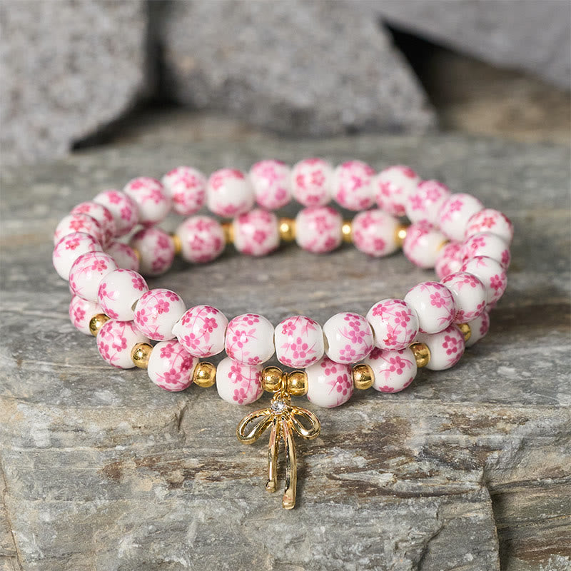 Buddha Stones Pulsera de cuentas de porcelana azul, blanca y rosa con lazo y palabra de honor - image 7