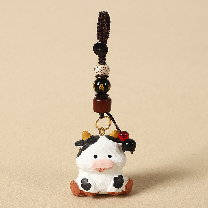 Buddha Stones Llavero chino de madera de tilo con grabado de flor de ciruelo, paz, seguridad, Om Mani Padme Hum positivo - Buey de 4 cm (el color, la forma y el tamaño pueden variar). - Om Mani Padme Hum - image 10