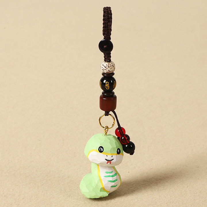 Buddha Stones Llavero chino de madera de tilo con grabado de flor de ciruelo, paz, seguridad, Om Mani Padme Hum positivo - Serpiente de 4 cm (el color, la forma y el tamaño pueden variar). - Om Mani Padme Hum - image 22