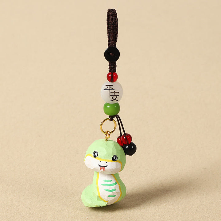 Buddha Stones Llavero chino de madera de tilo con grabado de flor de ciruelo, paz, seguridad, Om Mani Padme Hum positivo - Serpiente de 4 cm (el color, la forma y el tamaño pueden variar). - Paz y seguridad - image 25