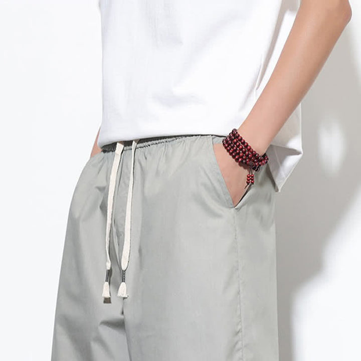 Buddha Stones Pantalones harem de algodón liso para hombre, estilo casual de verano, con cordón ajustable, aberturas laterales y bolsillos. - image 28
