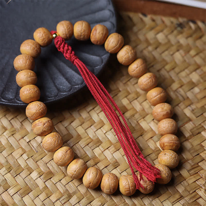 Buddha Stones Mala de muñeca tibetana con borla grabada y diseño del Ojo de Fénix y la Sabiduría Bodhi - image 1