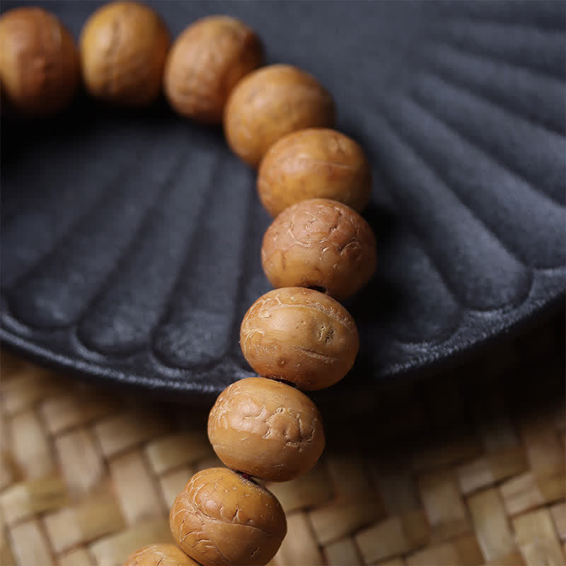 Buddha Stones Mala de muñeca tibetana con borla grabada y diseño del Ojo de Fénix y la Sabiduría Bodhi - image 9