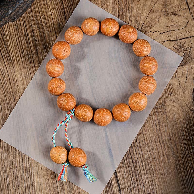 Buddha Stones Mala étnica tallada a mano con el símbolo del ojo de fénix y la sabiduría de Bodhi - dije de pulsera mala con forma de ojo de fénix - 15 mm - Bodhi Ojo de Fénix (Protección♥Sabiduría) - image 1