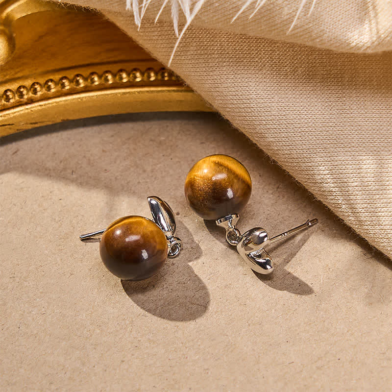 Buddha Stones Pendientes de cobre con diseño de corazón y ojo de tigre - image 1