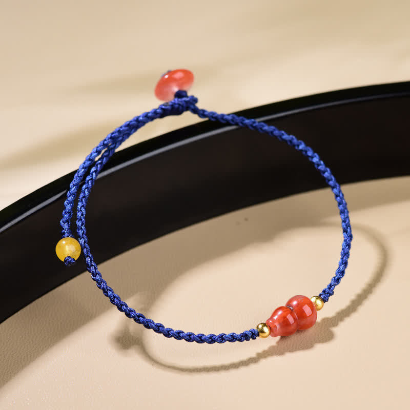 Buddha Stones Pulsera de hilo azul tejida a mano con ágata roja del sur y diseño de calabaza. - image 1