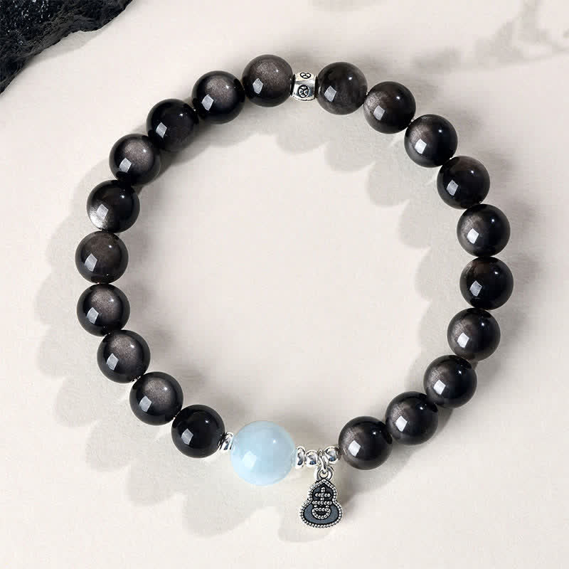 Buddha Stones Pulsera redonda de calabaza de la suerte con brillo plateado, obsidiana y aguamarina. - image 1
