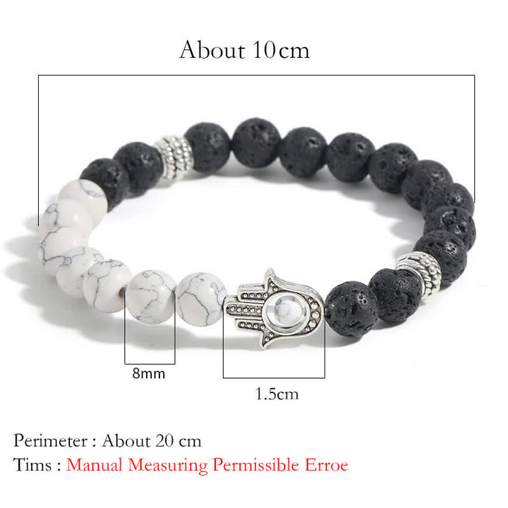 Buddha Stones Pulsera redonda artesanal de protección con diseño de palma de Hamsa y roca de lava - image 15