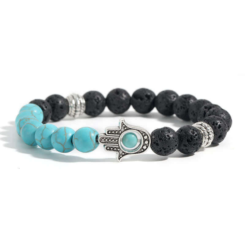 Buddha Stones Pulsera redonda artesanal de protección con diseño de palma de Hamsa y roca de lava - image 10