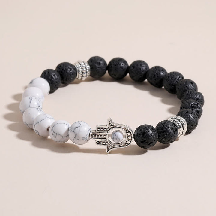Buddha Stones Pulsera redonda artesanal de protección con diseño de palma de Hamsa y roca de lava - image 0