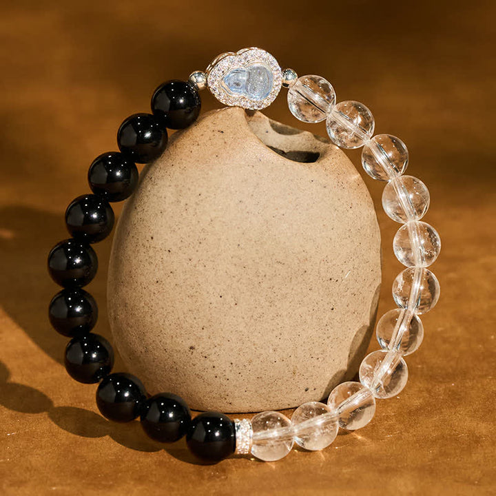 Buddha Stones Pulsera de cuarzo transparente, obsidiana negra y forma de calabaza. - Cuarzo transparente y obsidiana negra (circunferencia de la muñeca: 15-16 cm) - image 0
