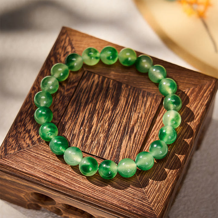 Buddha Stones Pulsera redonda de cuentas con flor flotante verde y calcedonia blanca - image 1