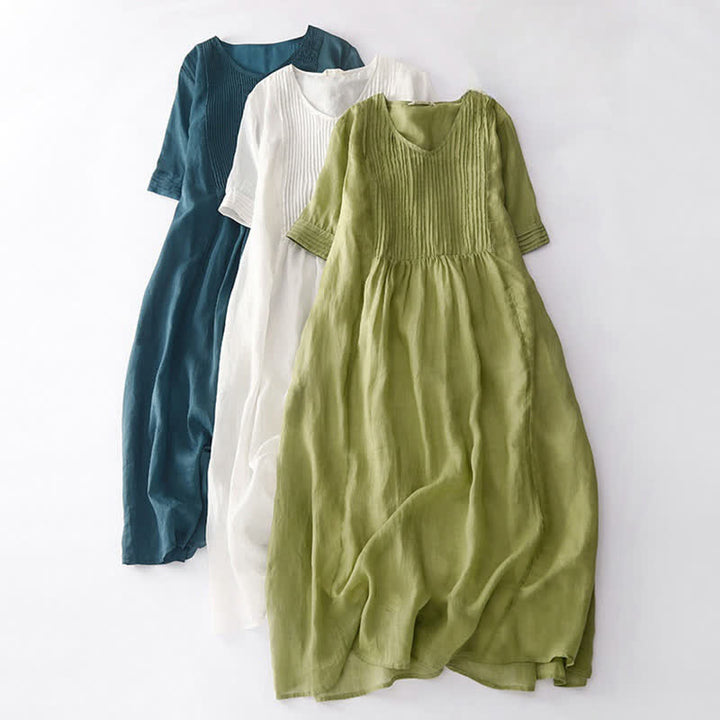 Vestido midi informal de manga corta con cuello en V, pliegues tipo acordeón y bolsillos, con estampado de Buddha Stones. - image 0