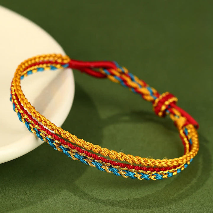 Buddha Stones Pulsera trenzada a mano con cordón de hilo colorido de triple vuelta y diseño de fe. - Azul Rojo Amarillo - image 0