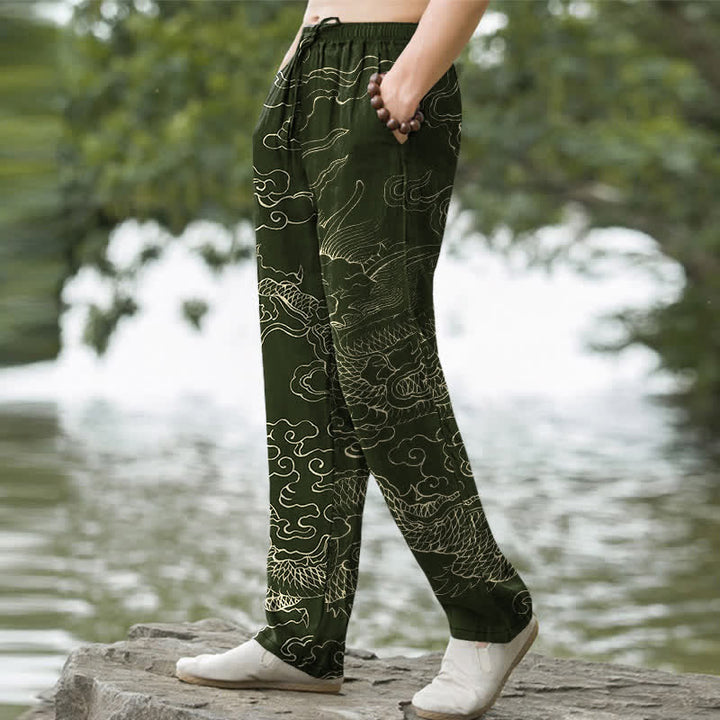 Buddha Stones Pantalones de algodón para hombre con estampado de dragón volador persiguiendo el sol, corte cónico y bolsillos. - image 1