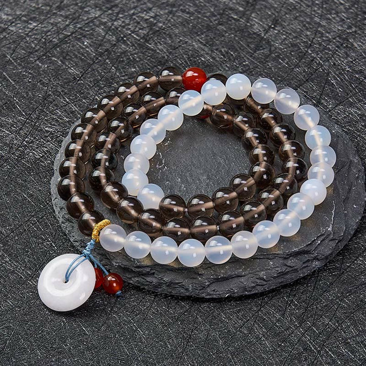 Buddha Stones Pulsera multienrollada con hebilla de paz de obsidiana de hielo y calcedonia blanca, modelo Serenity. - image 1