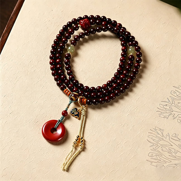 Buddha Stones Mala de protección con hebilla de paz de sándalo rojo, tejido a mano, 108 cuentas. - Palo de rosa rojo (Energía de conexión a tierra ♥ Fuerza interior) - image 0