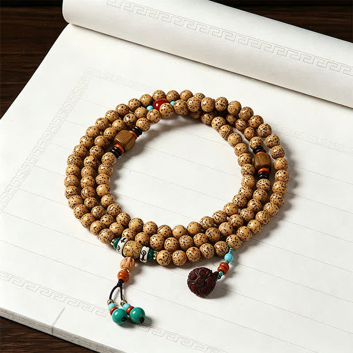 Buddha Stones Mala redonda de 108 cuentas con diseño de estrella, luna, semilla de Bodhi y vaina de loto, elaborada a mano. - Buda (Compasión ♥ Serenidad) - image 0
