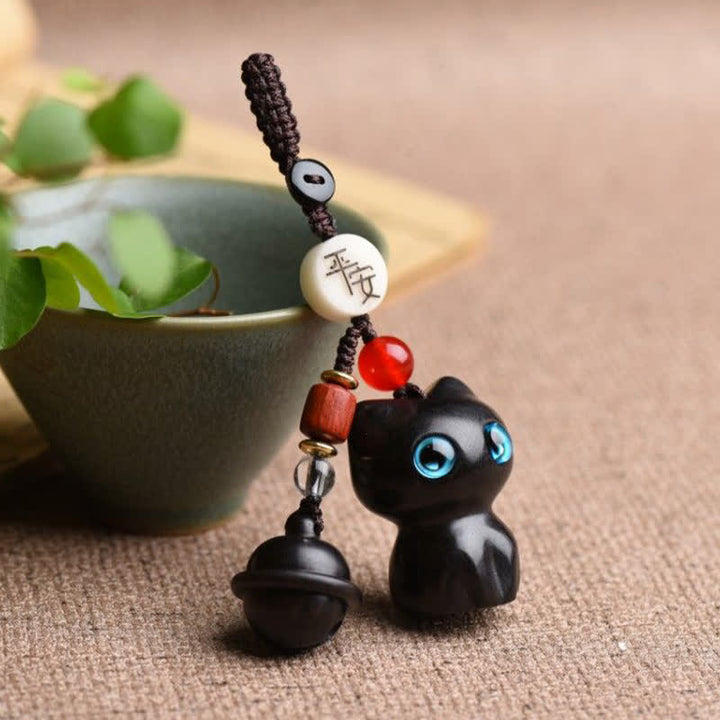 Buddha Stones Llaveros protectores con cascabel para gatos, tallados a mano en madera de ébano y sándalo rojo. - image 8