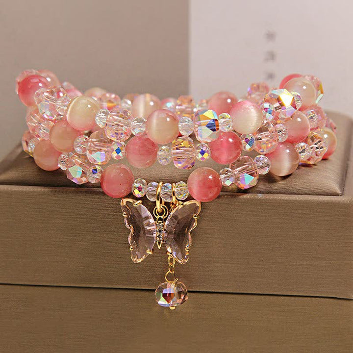 Buddha Stones Pulsera facetada triple con mariposa ojo de gato color melocotón - image 3