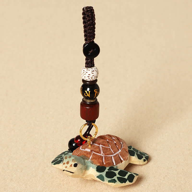 Buddha Stones Llaveros de tortuga tallada en madera con los símbolos Om Mani Padme Hum Focus - Om Mani Padme Hum Tortuga - image 3