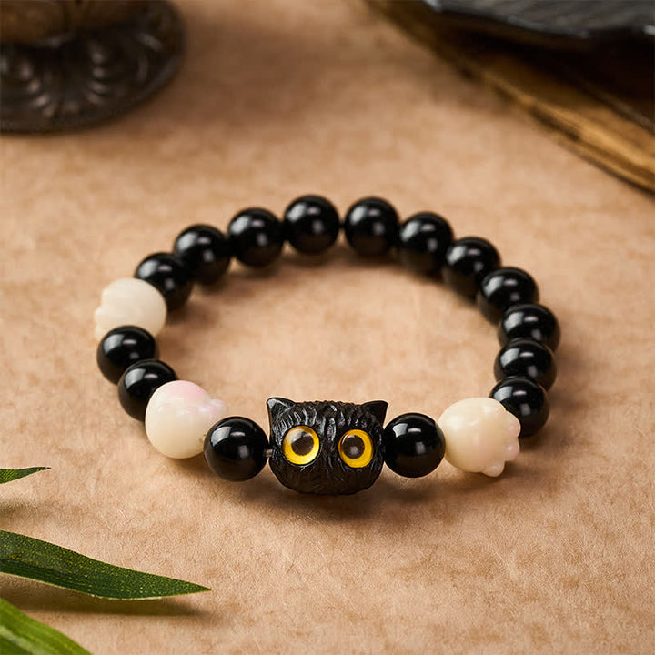 Buddha Stones Pulsera de cuentas de conexión a tierra con cabeza de gato de obsidiana negra tallada a mano y ojos amarillos - image 1
