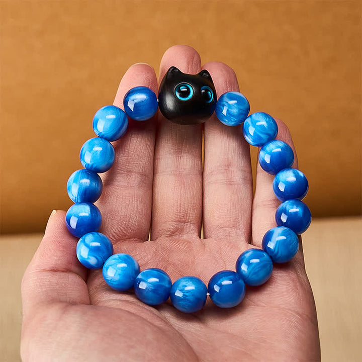 Buddha Stones Pulsera de equilibrio con forma de gato, cuentas de resina azul y madera de ébano. - image 5