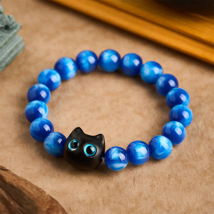 Buddha Stones Pulsera de equilibrio con forma de gato, cuentas de resina azul y madera de ébano. - 12 mm (circunferencia de la muñeca: 6,7-7,1 pulgadas / 17-18 cm) - image 0